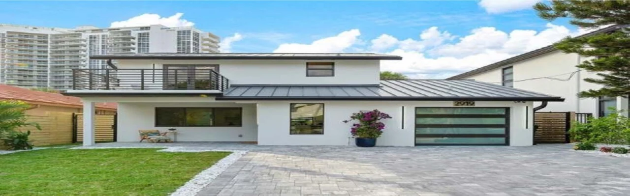 Modern South Florida home with a finished standing seam metal roof installed by DR Construction & Roofing