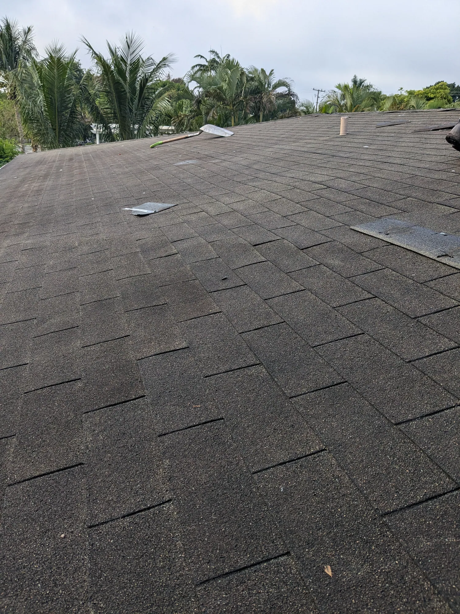 Grey architectural shingle re-roof by DR Construction & Roofing in South Florida