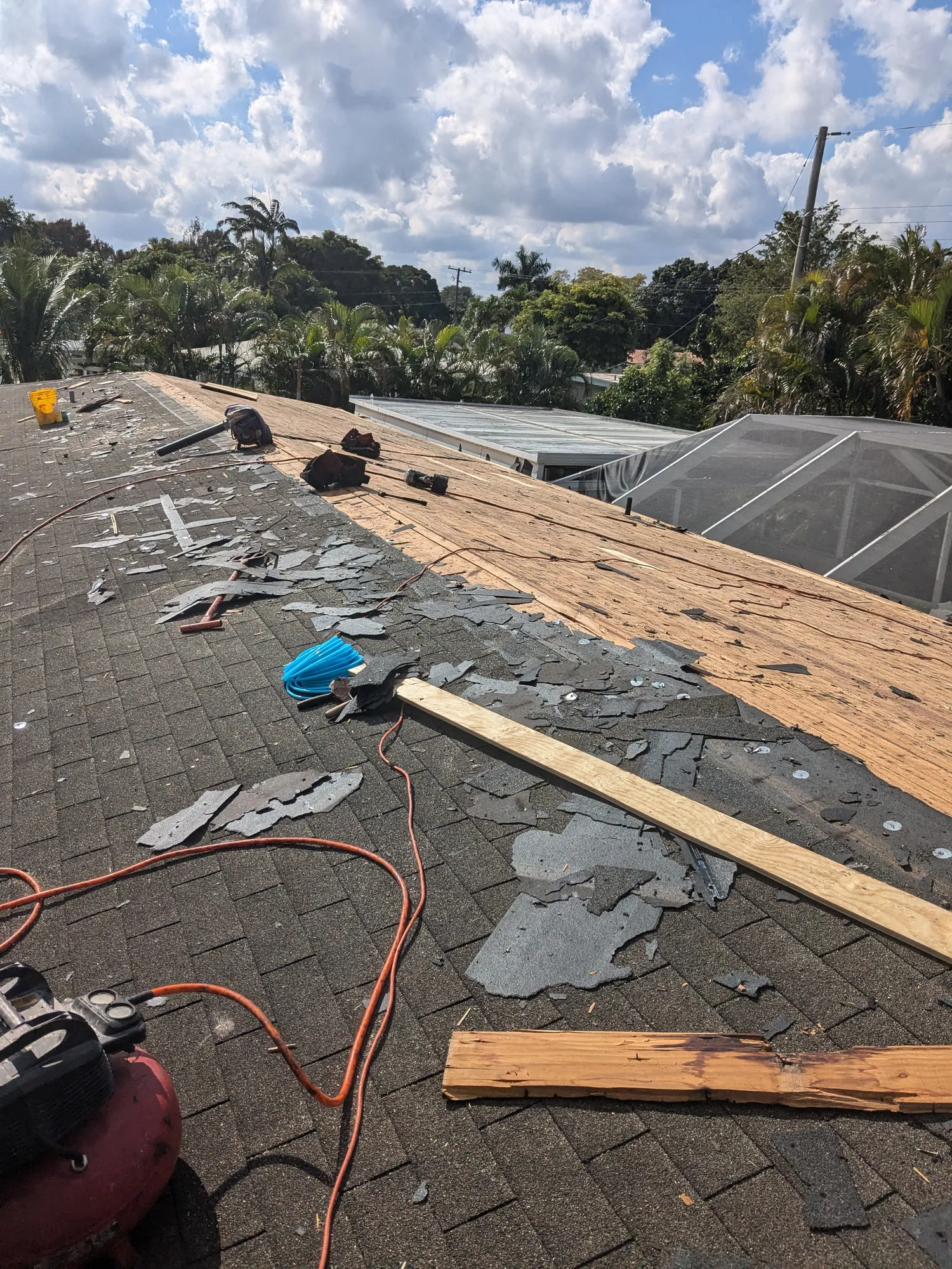 Grey architectural shingle re-roof by DR Construction & Roofing in South Florida