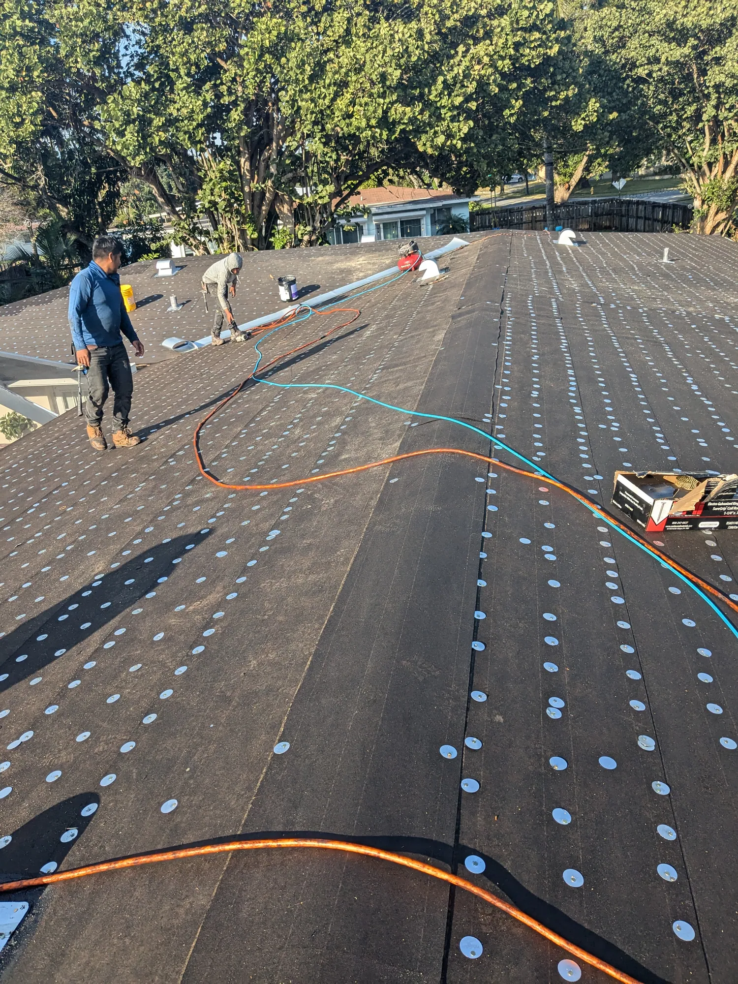 Grey architectural shingle re-roof by DR Construction & Roofing in South Florida