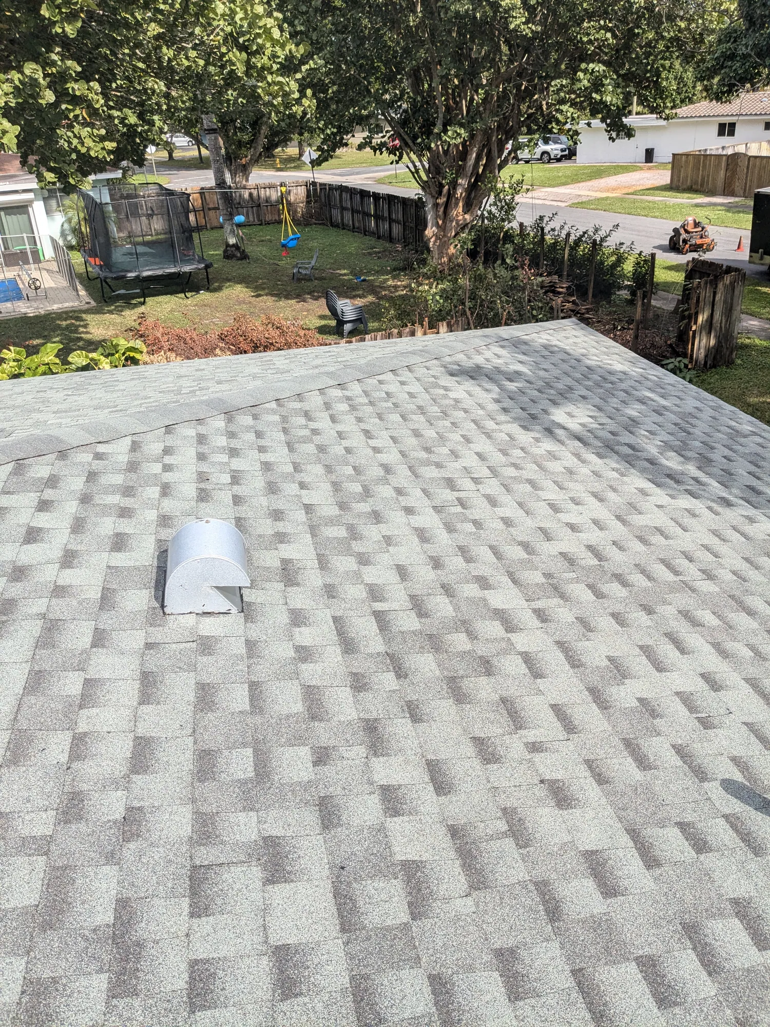 Grey architectural shingle re-roof by DR Construction & Roofing in South Florida