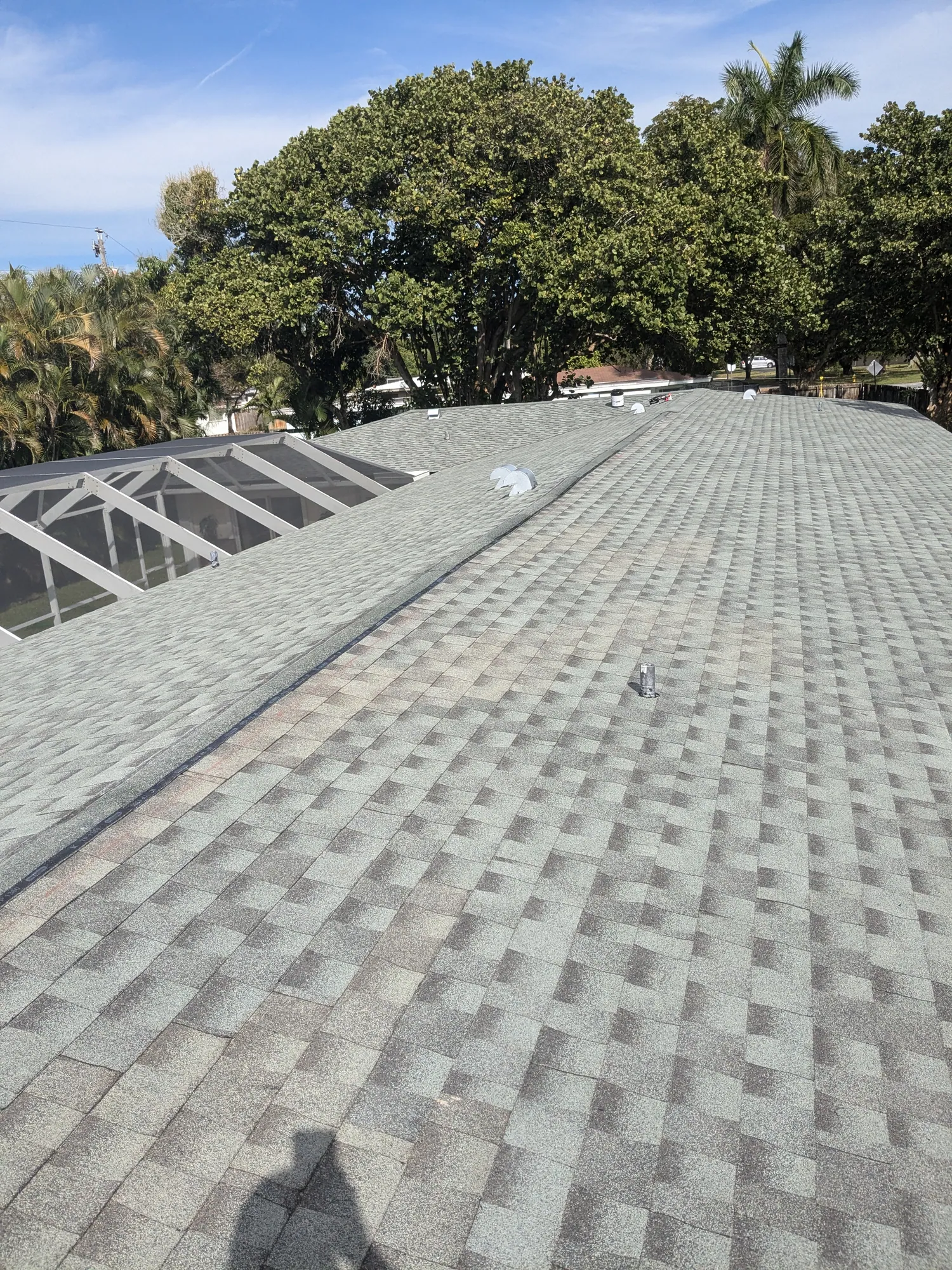 Grey architectural shingle re-roof by DR Construction & Roofing in South Florida
