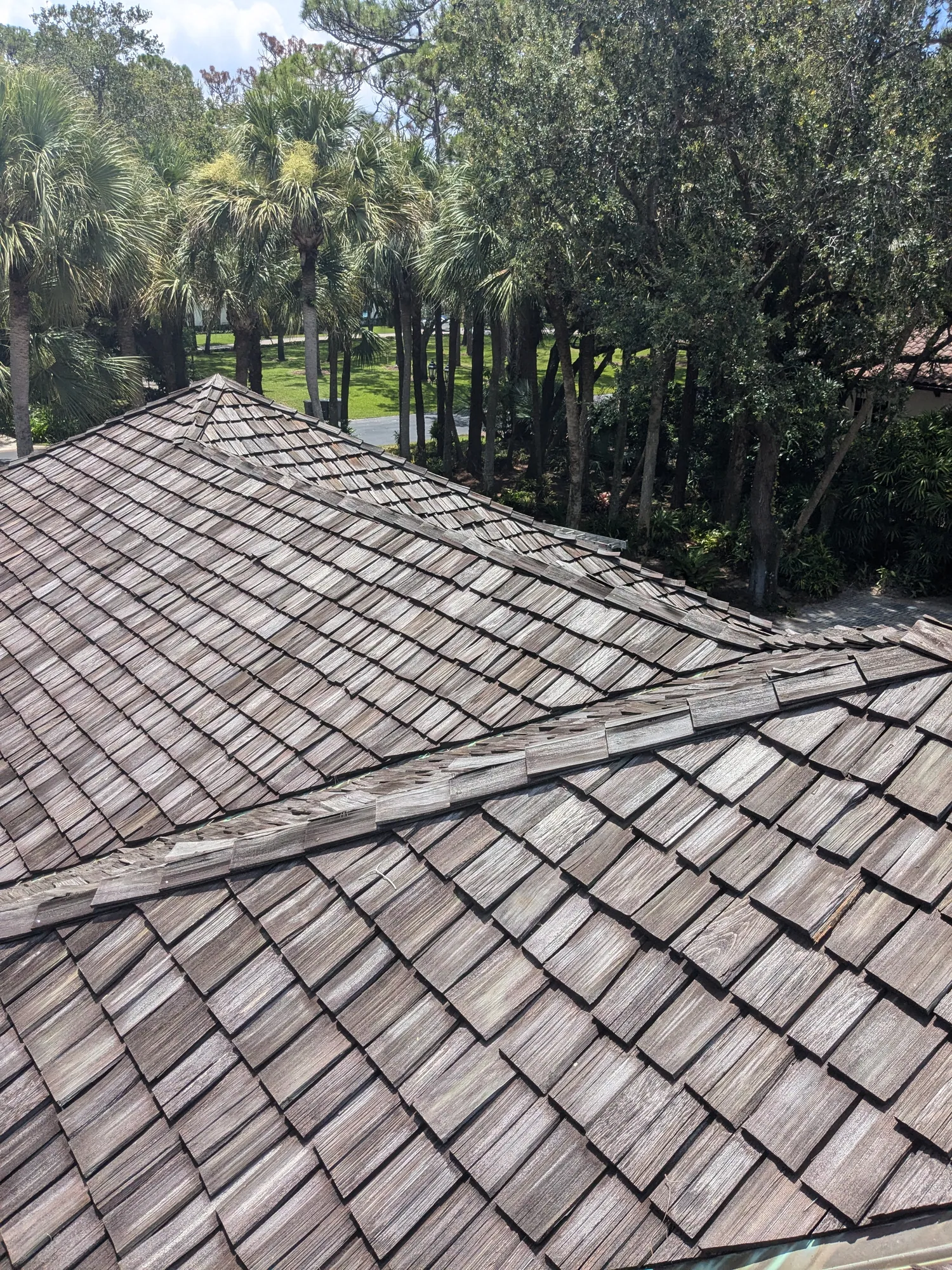 Charcoal flat tile roof installation by DR Construction & Roofing in South Florida