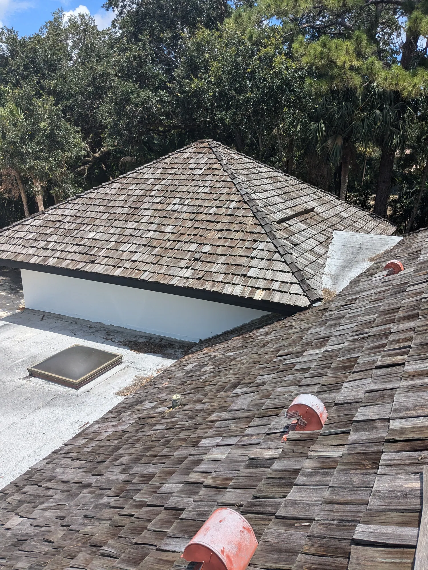 Charcoal flat tile roof installation by DR Construction & Roofing in South Florida