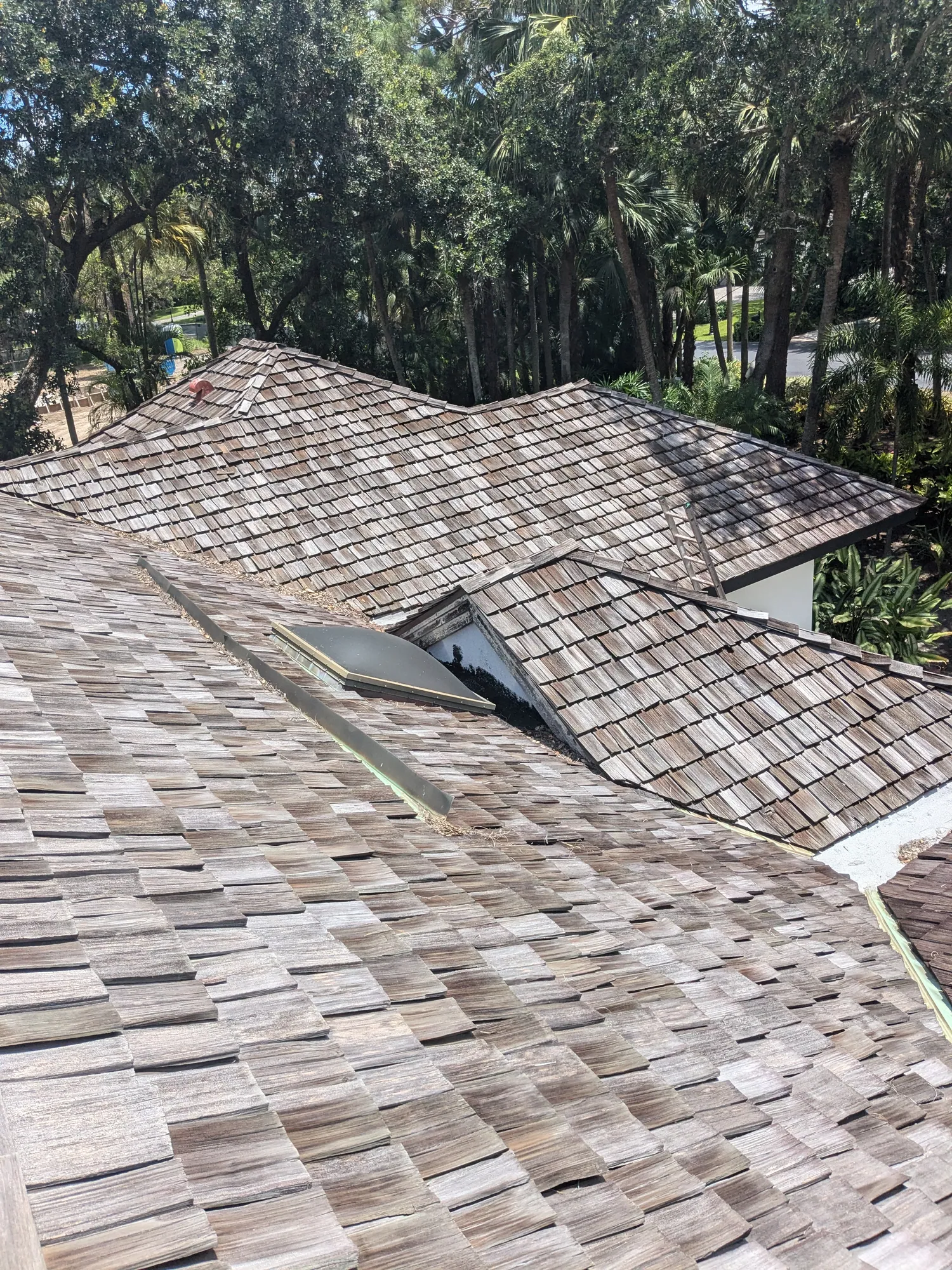 Charcoal flat tile roof installation by DR Construction & Roofing in South Florida