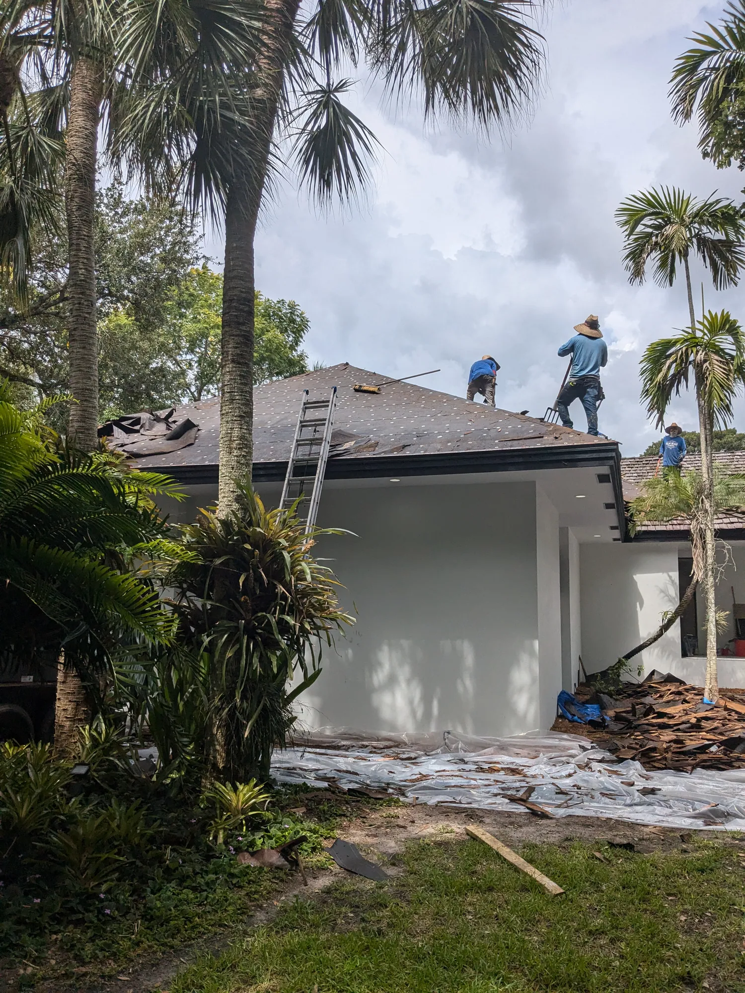Charcoal flat tile roof installation by DR Construction & Roofing in South Florida