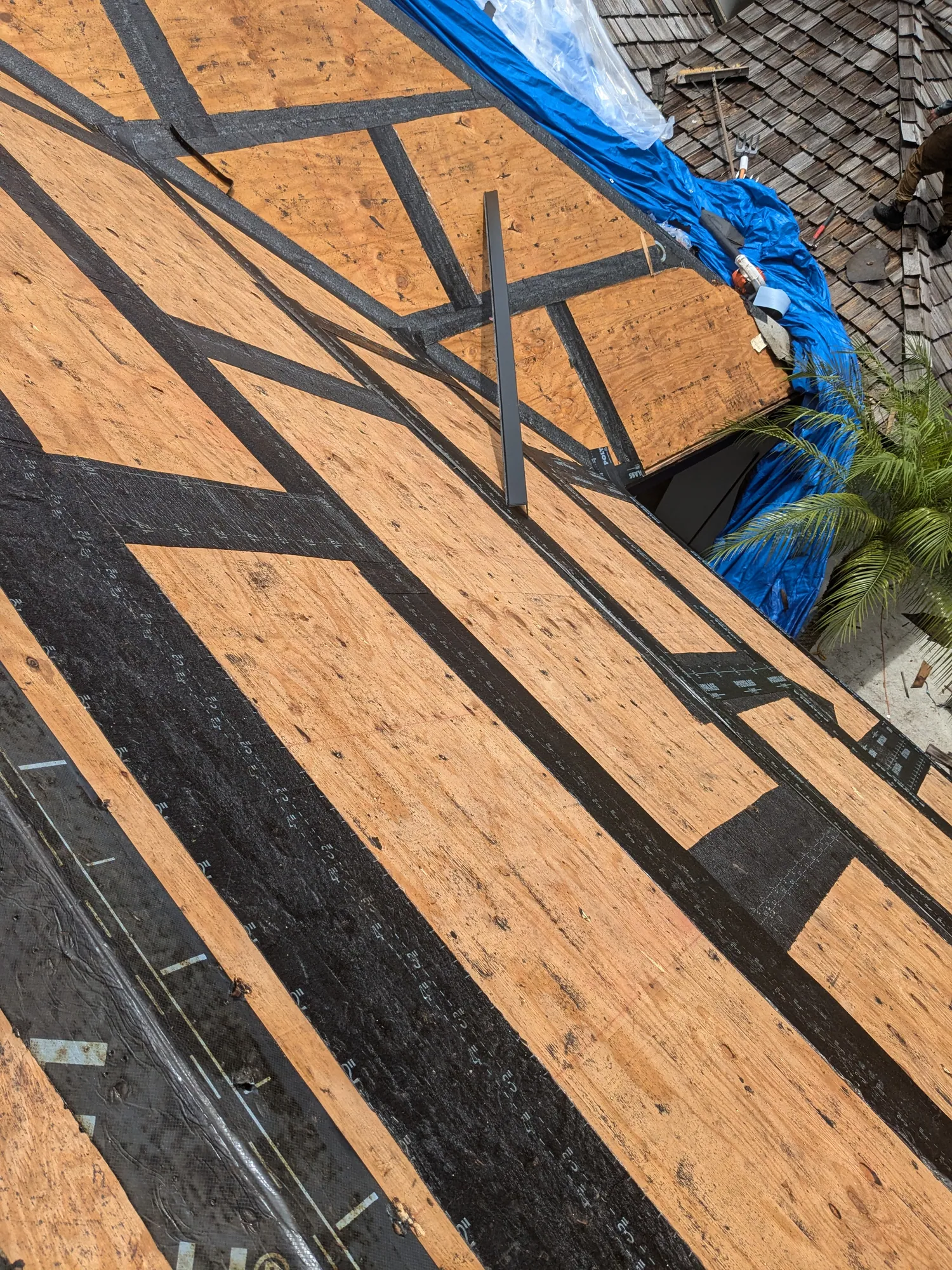 Charcoal flat tile roof installation by DR Construction & Roofing in South Florida