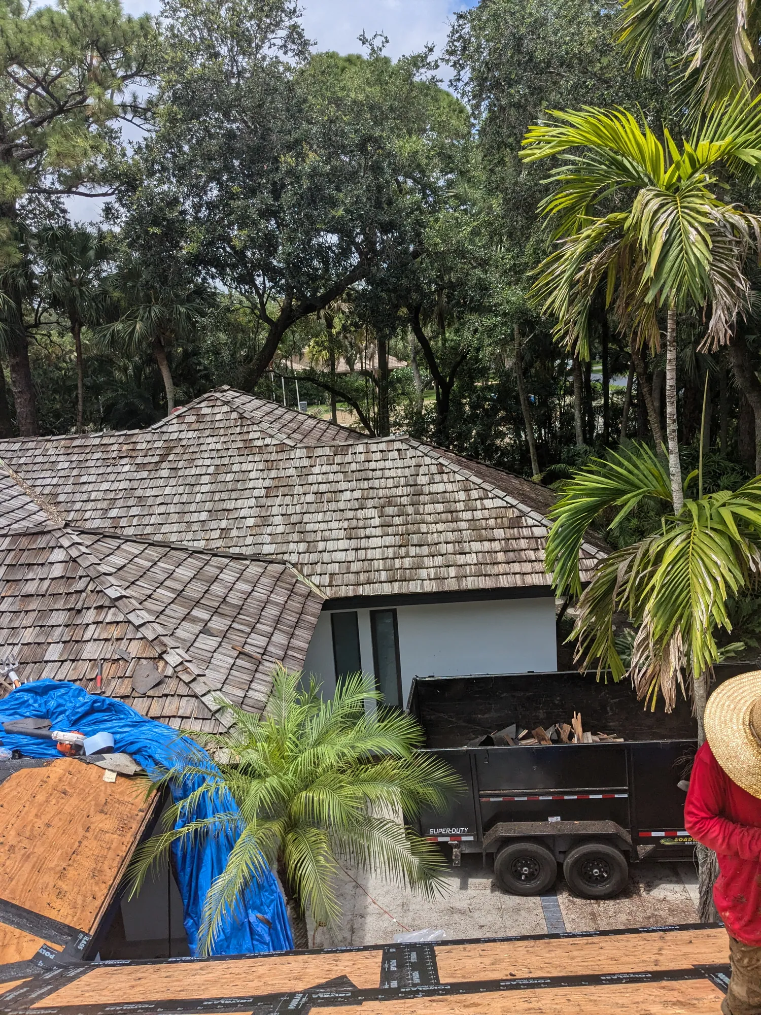Charcoal flat tile roof installation by DR Construction & Roofing in South Florida