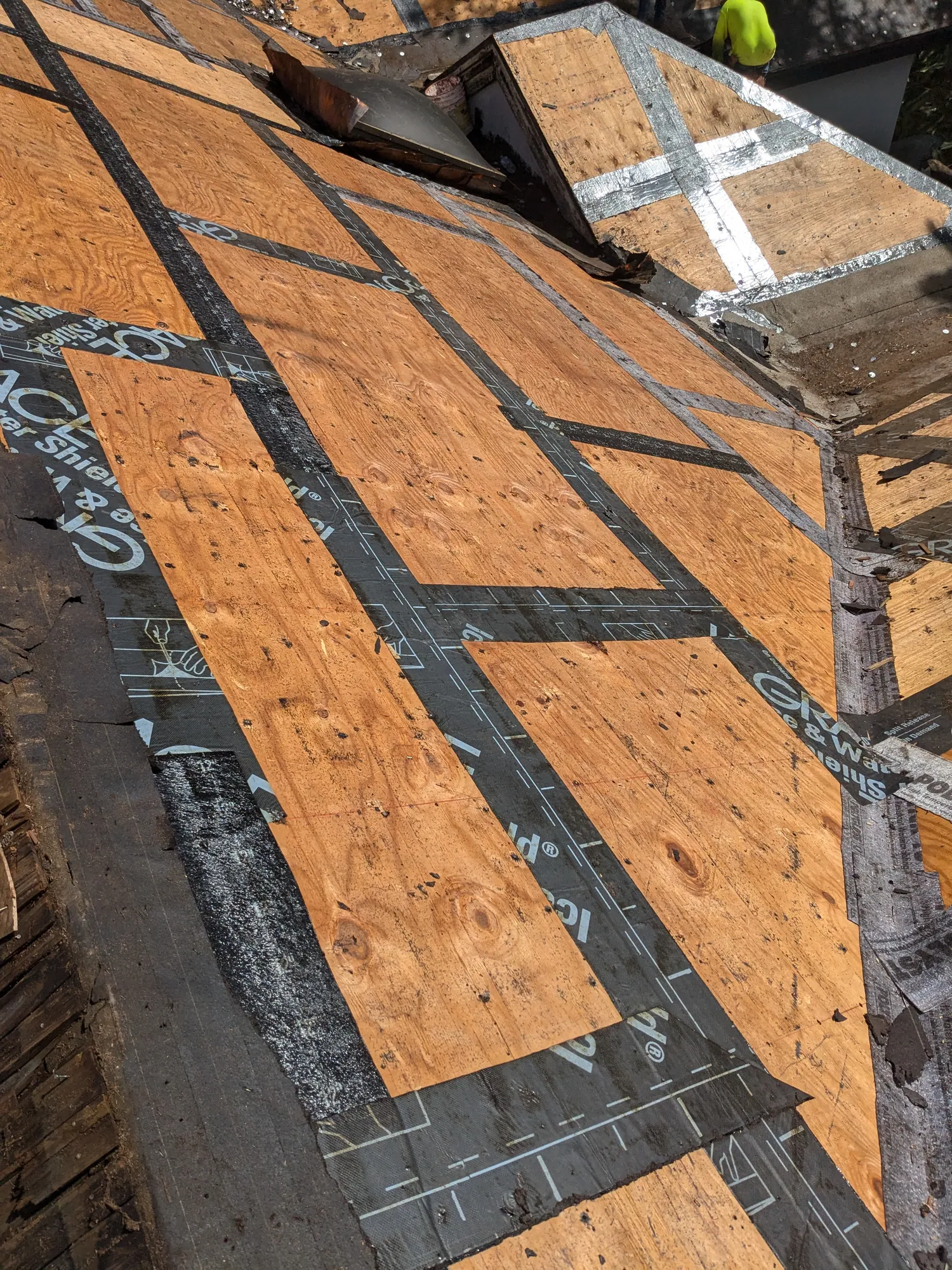 Charcoal flat tile roof installation by DR Construction & Roofing in South Florida