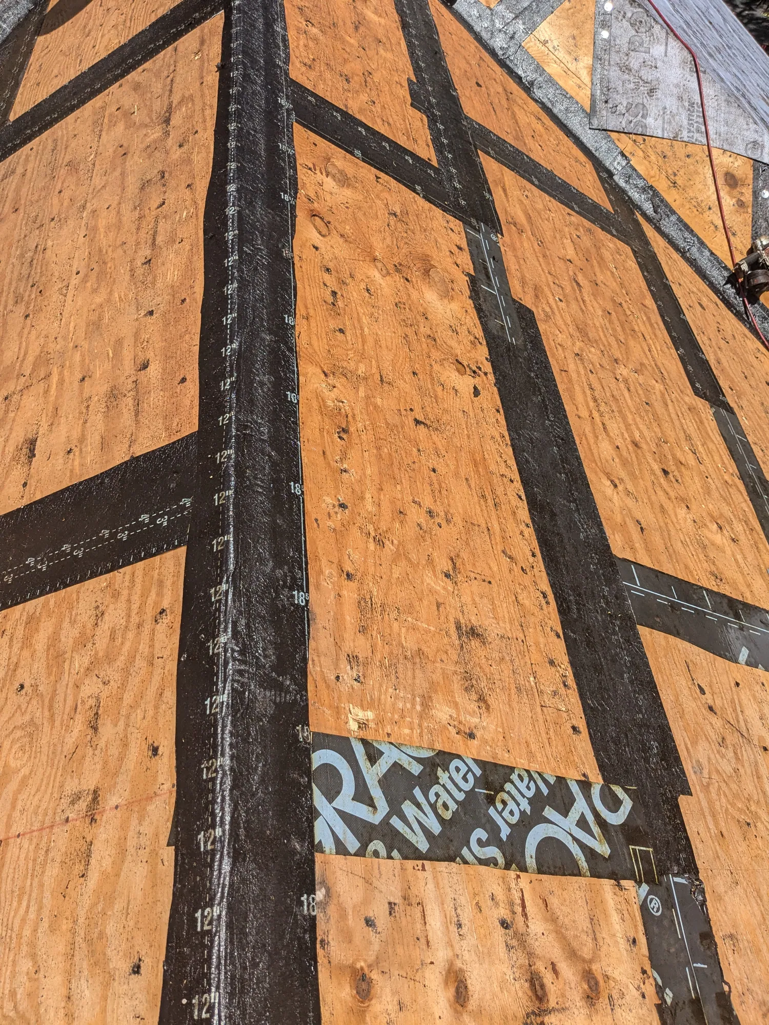 Charcoal flat tile roof installation by DR Construction & Roofing in South Florida