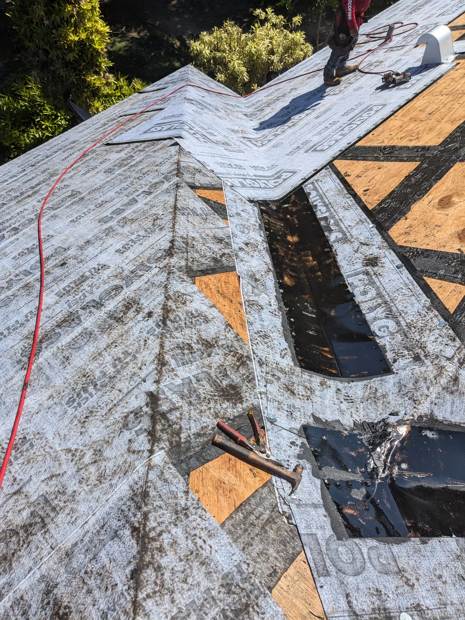 Charcoal flat tile roof installation by DR Construction & Roofing in South Florida