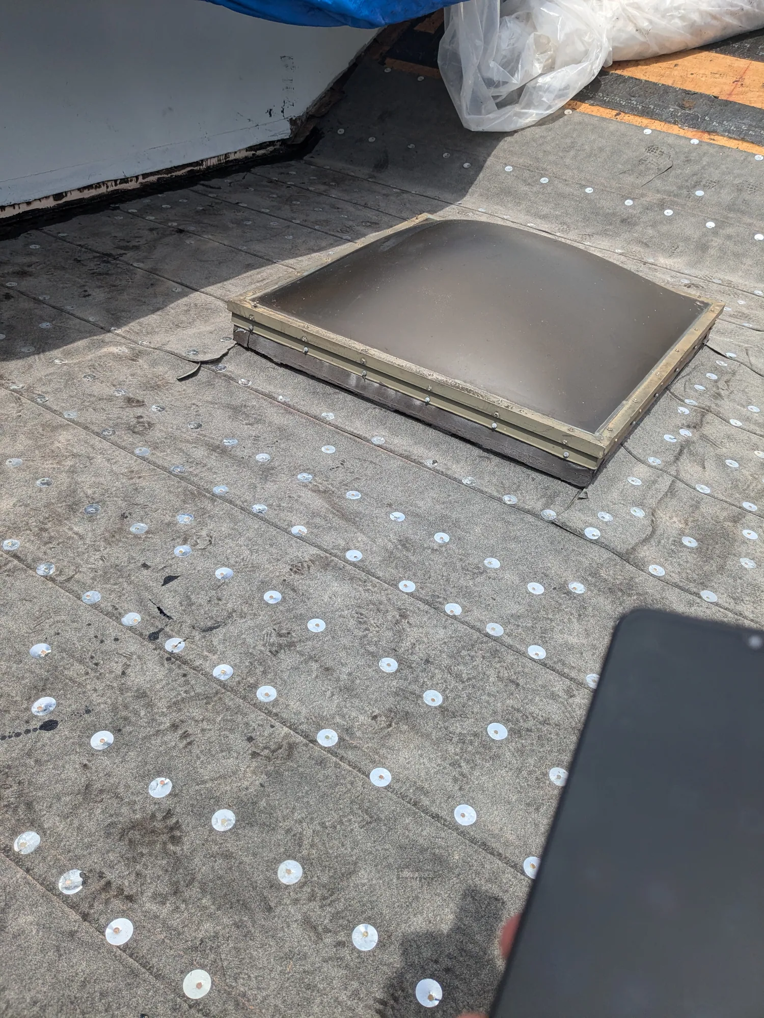 Charcoal flat tile roof installation by DR Construction & Roofing in South Florida