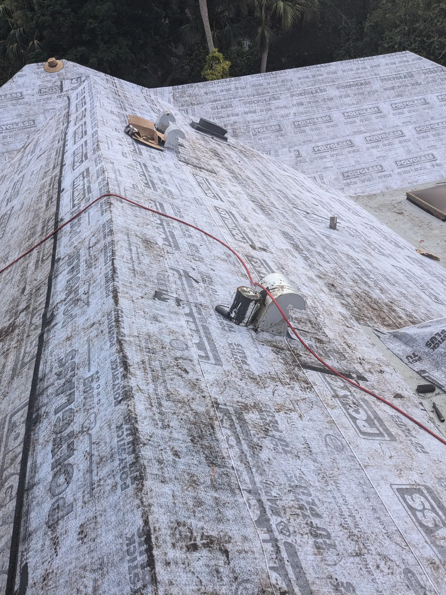 Charcoal flat tile roof installation by DR Construction & Roofing in South Florida
