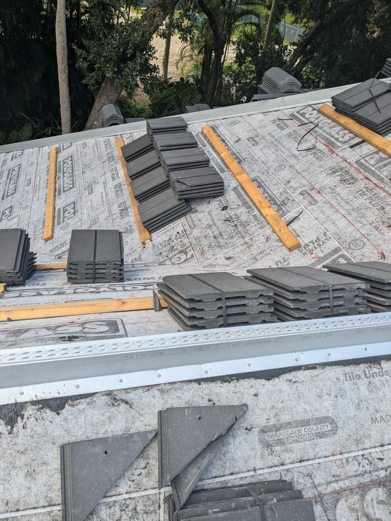 Charcoal flat tile roof installation by DR Construction & Roofing in South Florida
