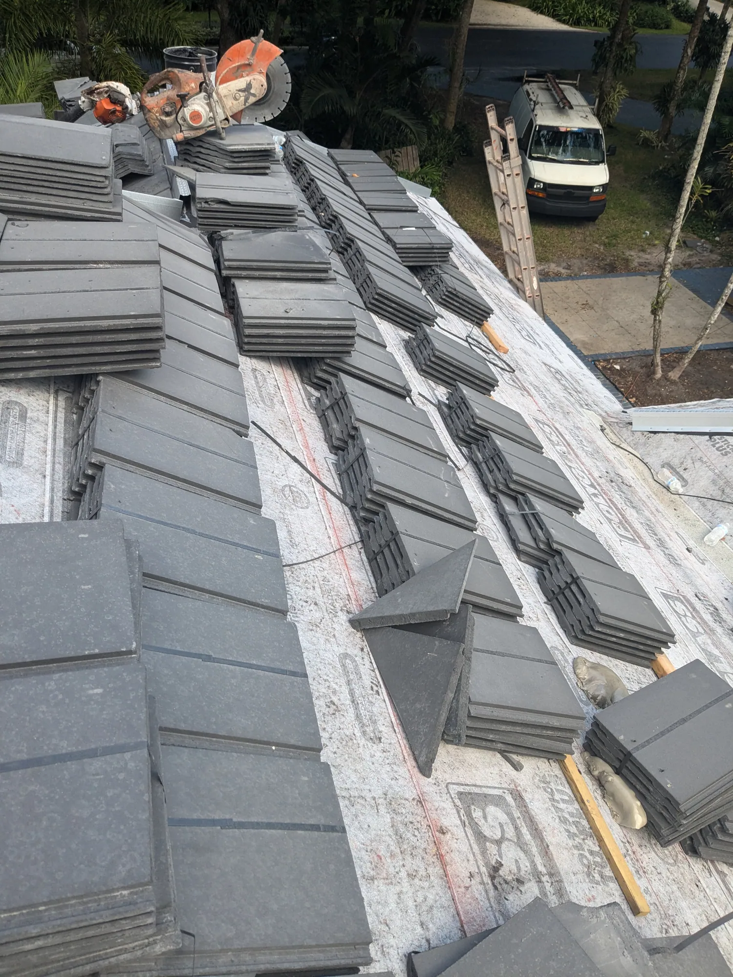 Charcoal flat tile roof installation by DR Construction & Roofing in South Florida