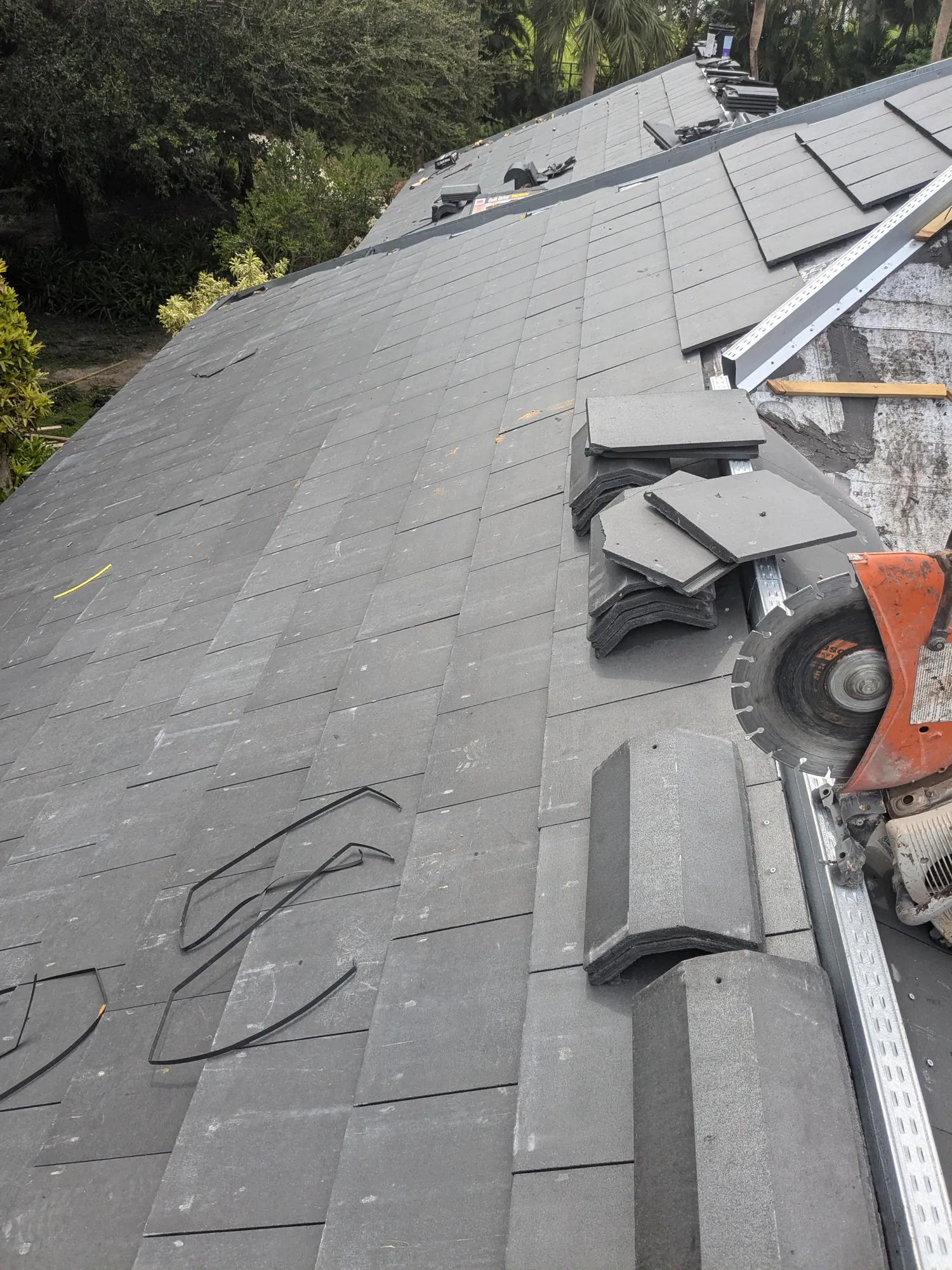 Charcoal flat tile roof installation by DR Construction & Roofing in South Florida