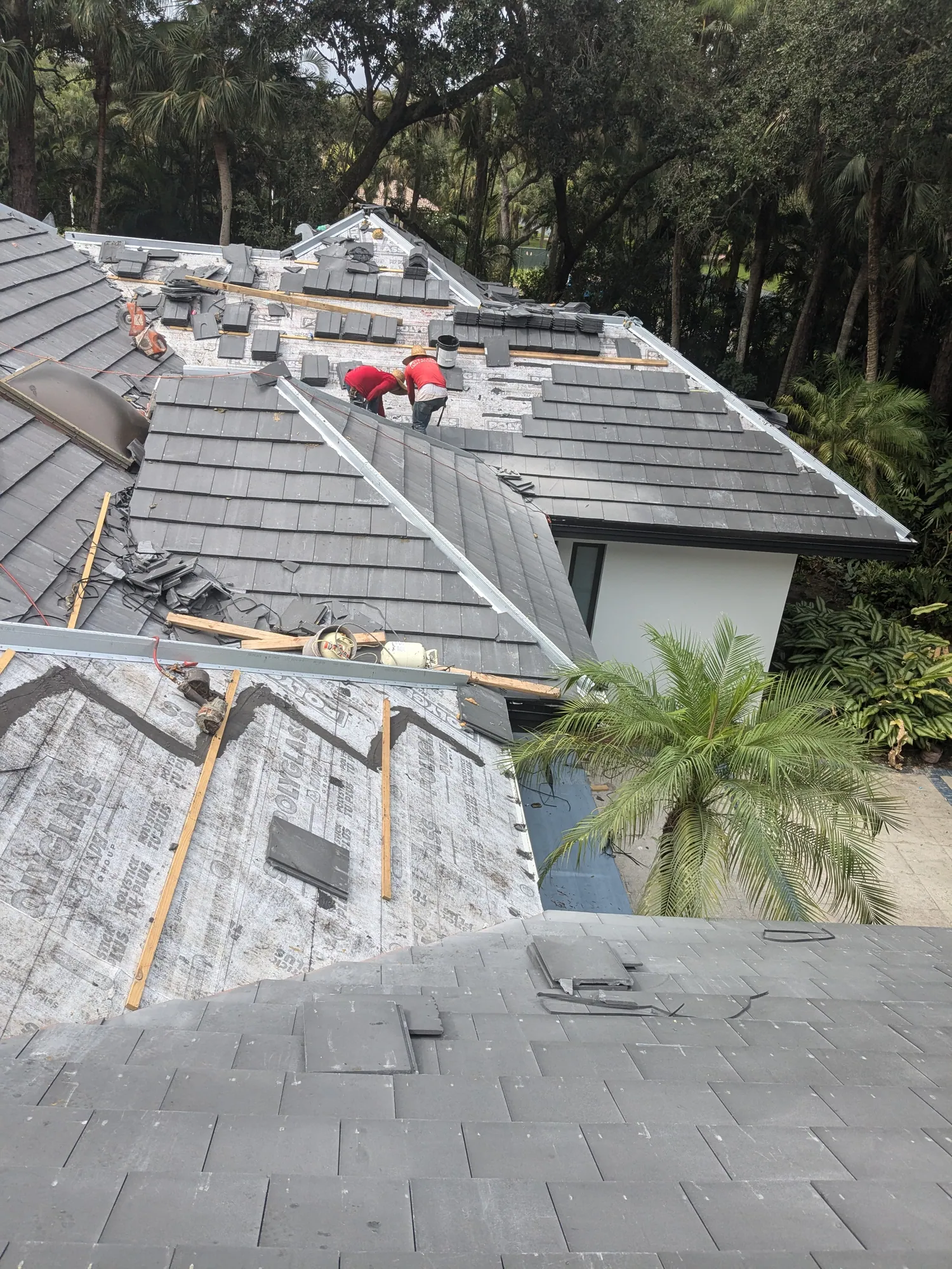 Charcoal flat tile roof installation by DR Construction & Roofing in South Florida
