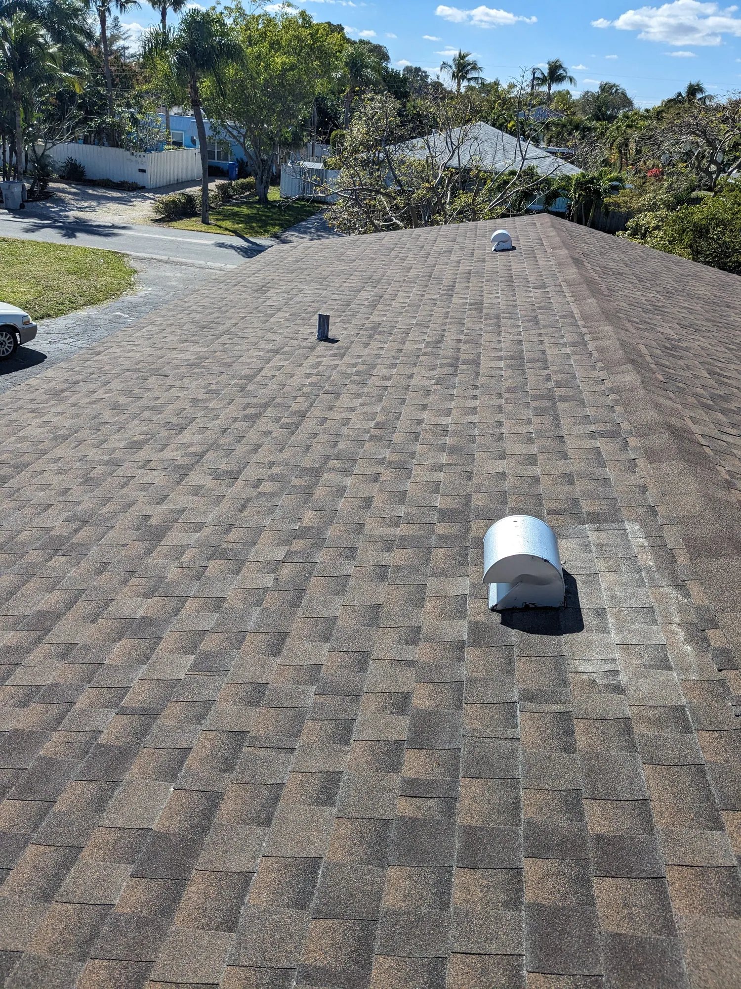 Brown architectural shingle re-roof by DR Construction & Roofing in South Florida