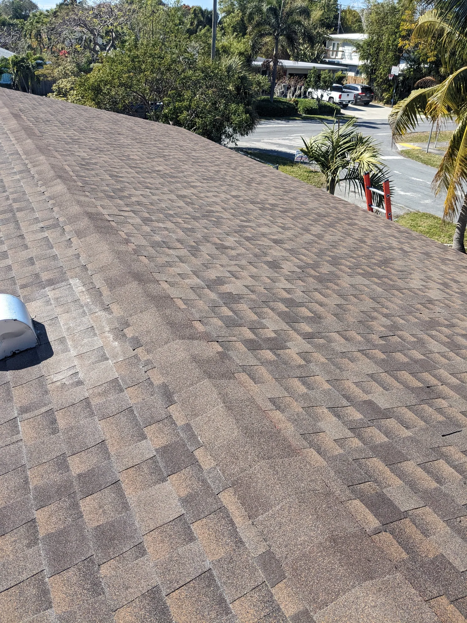 Brown architectural shingle re-roof by DR Construction & Roofing in South Florida
