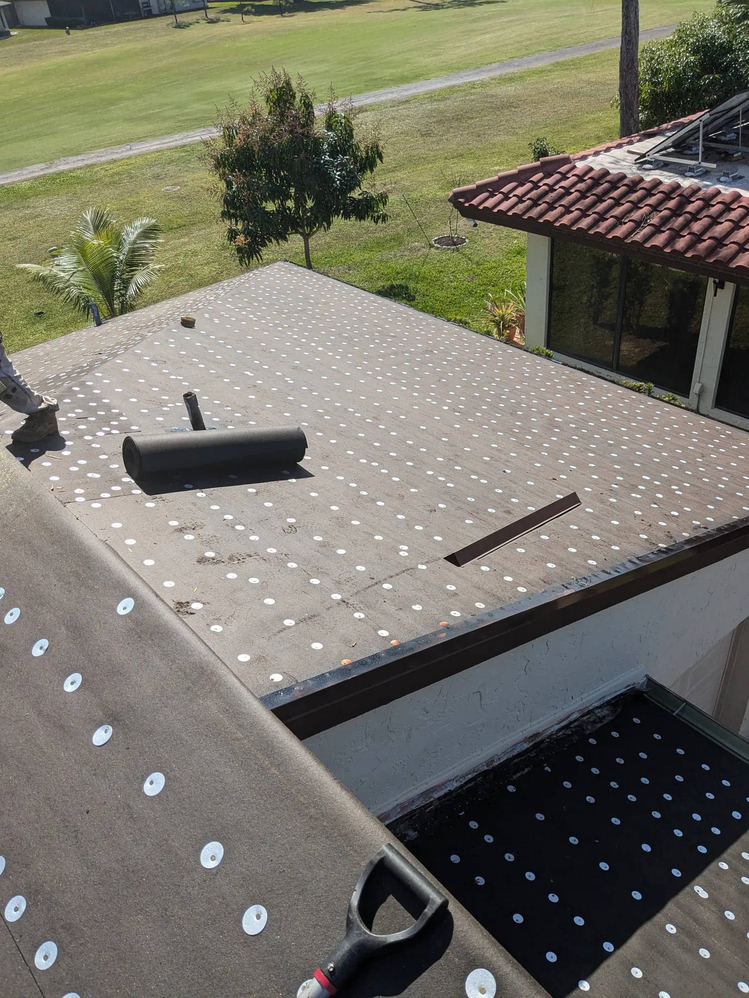 Terracotta barrel tile roof installation by DR Construction & Roofing in South Florida
