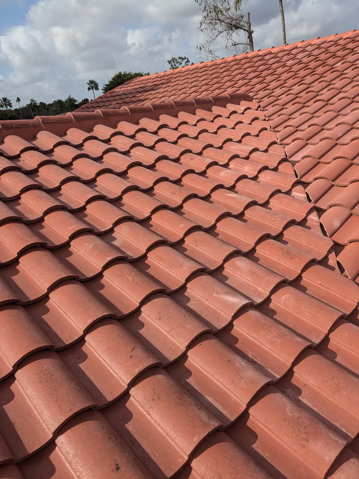 Terracotta barrel tile roof installation by DR Construction & Roofing in South Florida