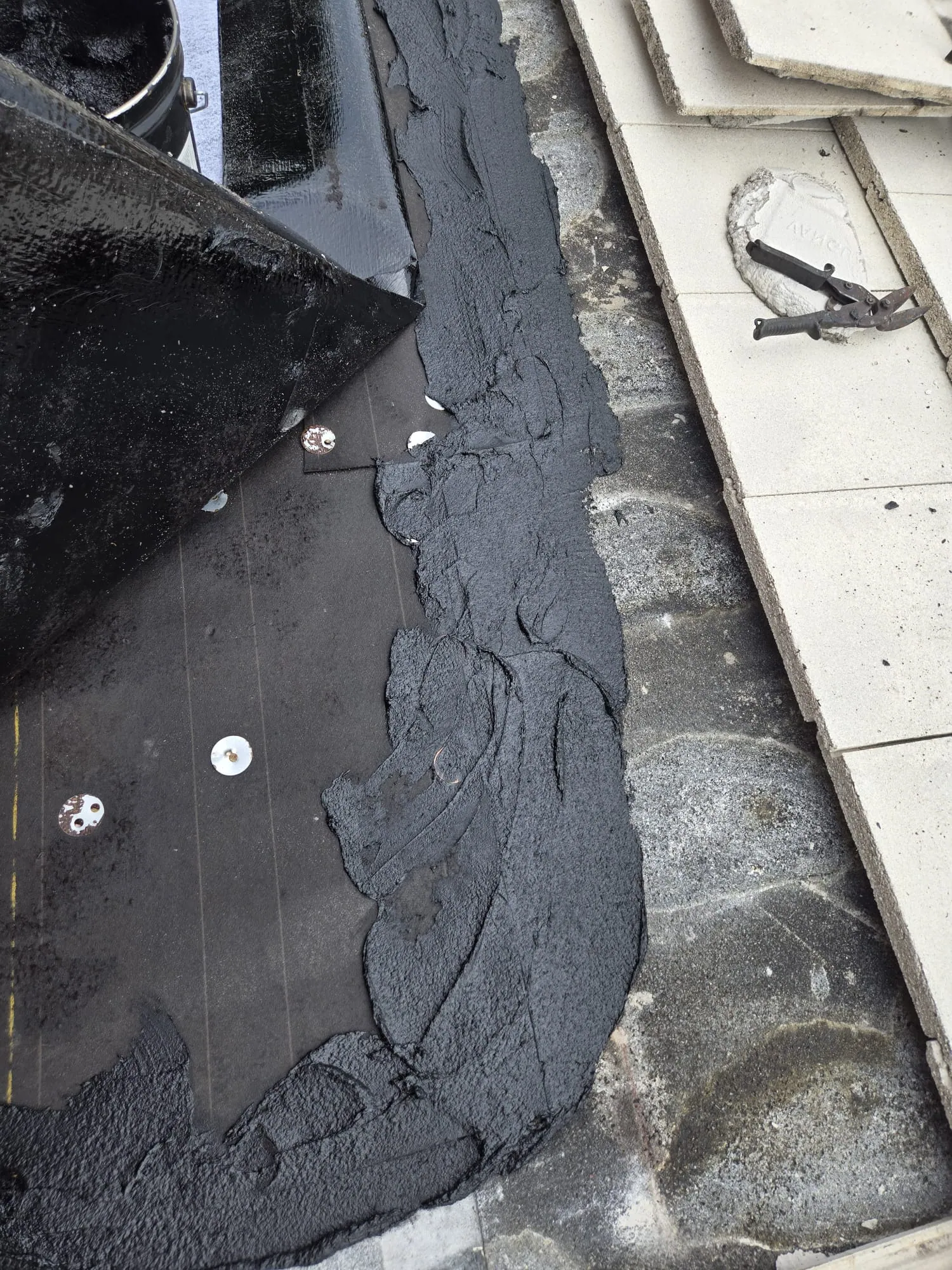 Close-up of tile patching during a South Florida residential roof repair